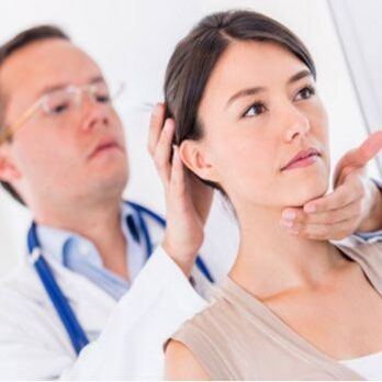 Neurologist examines a patient who has neck pain